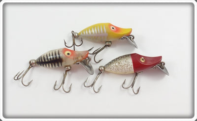 Heddon Tiny Runt Lot Of Three: Yellow Shore, Silver Shore, & Red Head Flitter